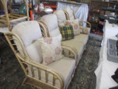 A three part cane furniture set - 2 single seats and a two seater
