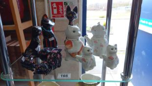 4 graduated Chinese pottery cat teapots & a quantity of painted lacquered cat ornaments