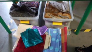 Three large boxes of assorted fabrics.