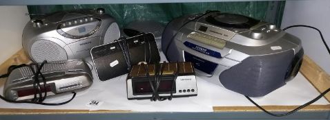 A quantity of radio alarm clocks and other radio / CD players