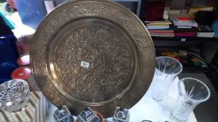 A large silver plated charger wall plate. Diameter 9.5cm