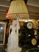 A mid 20th century plaster figural table lamp in good condition marked Tuscas.