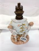 A Victorian porcelain cherub oil lamp base, (cross swords mark).