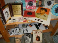 A quantity of Elvis collectables including records.