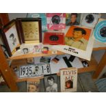 A quantity of Elvis collectables including records.