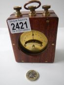 A portable vetical differential galvanometer in wooden case, circa 1920.