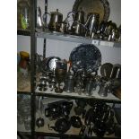Three shelves of assorted metal ware including tea sets, trays etc., COLLECT ONLY.