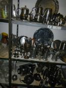 Three shelves of assorted metal ware including tea sets, trays etc., COLLECT ONLY.