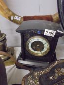 A black slate mantel clock.