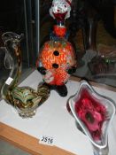 A Murano style glass clown decanter and two other items of glass ware.