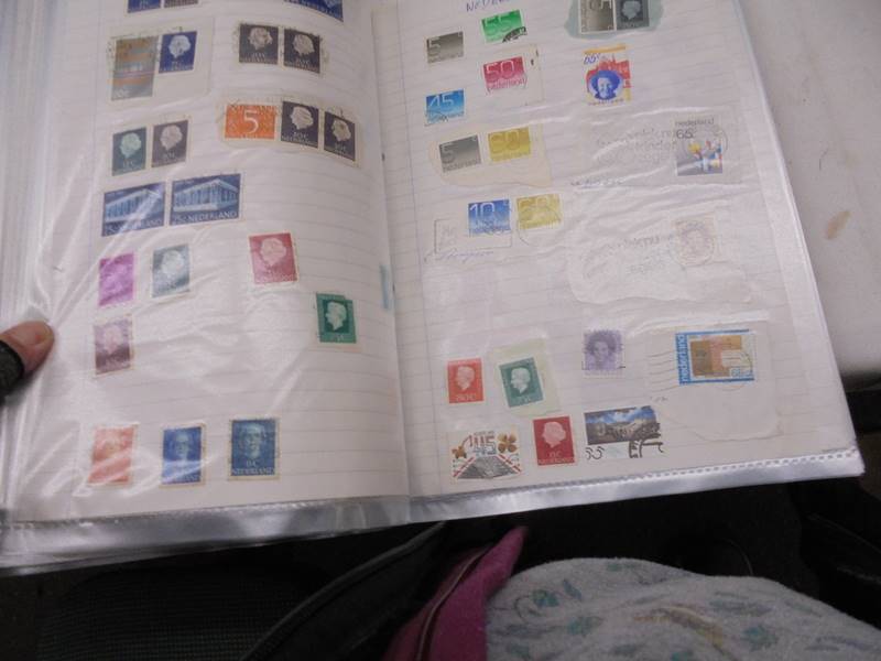 A large folder of UK stamps up to 2000 and a large folder of world stamps. - Image 7 of 17