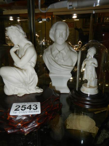 A bust of Shakespeare, a female figure and a figure under dome.