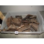 A box of cast iron flat irons COLLECT ONLY