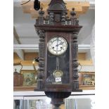 A Victorian mahogany wall clock in working order. COLLECT ONLY.