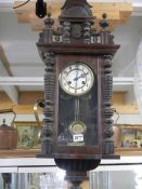 A Victorian mahogany wall clock in working order. COLLECT ONLY.