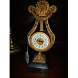 An old brass lyre shaped clock, a/f.