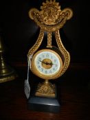 An old brass lyre shaped clock, a/f.