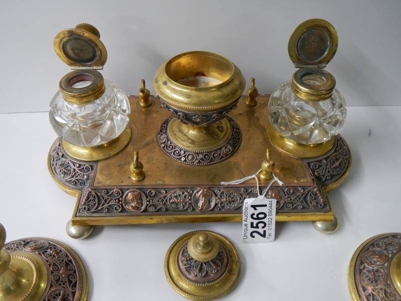 A late Victorian gilt bronze desk stand with matching inkwells and candlesticks. - Image 4 of 7