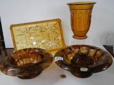 Two cloud glass bowls, an amber glass vase featuring figures and an amber glass tray.