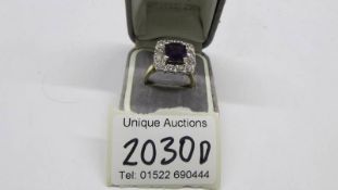 An 18ct gold amethyst and diamond ring, size J, total weight 8.2 grams.