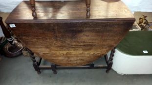 A 1930's oak barley twist gateleg table COLLECT ONLY