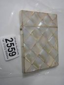A mother of pearl card case in good condition.