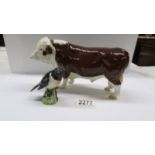 A Beswick Herefordshire bull and a Beswick stonechat.