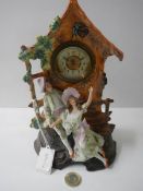 A ceramic clock featuring courting couple.