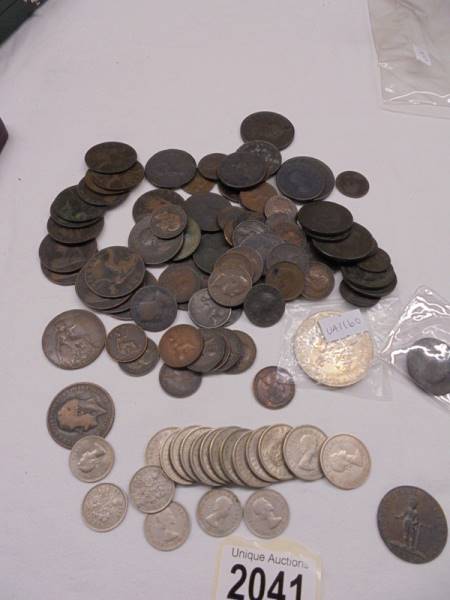 A mixed lot of copper coins etc., including Birmingham half penny.