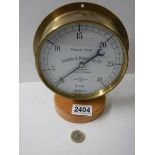 A brass cased vacuum gauge by Schaffer & Budenburg of Manchester, London and Glasgow.