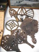 A quantity of 19c and 20c cast iron trivets