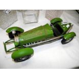 A green pressed steel model of a 1930's racing car, length 35cm