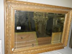 An antique gilt framed bevel edged mirror, COLLECT ONLY.