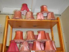 A quantity of pink lamp shades.