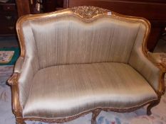 A gilt framed two seater sofa. COLLECT ONLY.