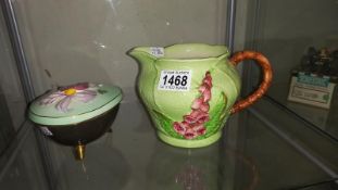 A Carlton ware hand painted easter egg trinket pot and a cabbage leaf jug