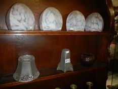 Four 1930's mottled glass lampshades and one other.