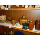 A shelf of ceramics.