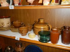 A shelf of ceramics.