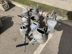 9 galvanised watering cans