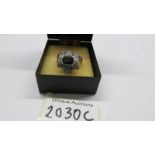 An 18ct white gold diamond and sapphire ring, size P, total weight 8.9 grams.