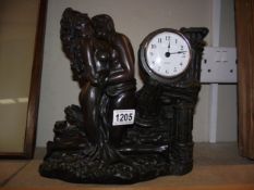 A bronzed resin classical themed mantle clock