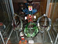 A Murano style glass clown and three other items of glass ware.