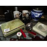 A mixed lot including Onyx jewellery box, flasks, Swiss army knife, Victorian biscuit jar etc