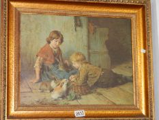 A gilt framed study of children with rabbits, signed. COLLECT ONLY.