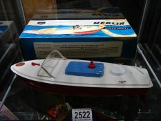 A boxed Merlin electric speedboat.