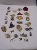 Approximately twenty five vintage brooches.