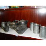 A silver plate teaset and a quantity of tankards.