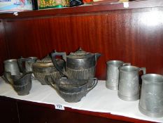 A silver plate teaset and a quantity of tankards.