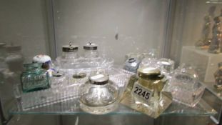 A good lot of old mainly glass inkwells.